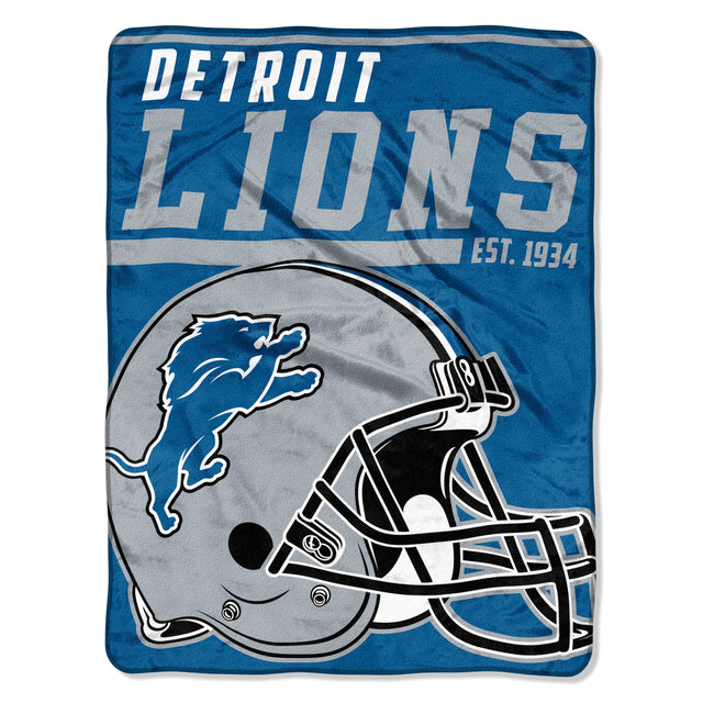 Manta Detroit Lions 46x60 Micro Raschel Diseño Dash de 40 yardas enrollada