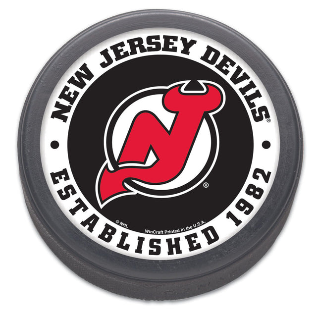 Empaquetado de disco de hockey de los New Jersey Devils, diseño original de 1982