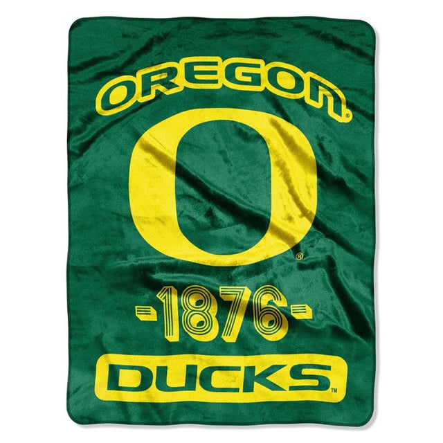 Manta Oregon Ducks 46x60 Micro Raschel Diseño universitario enrollado