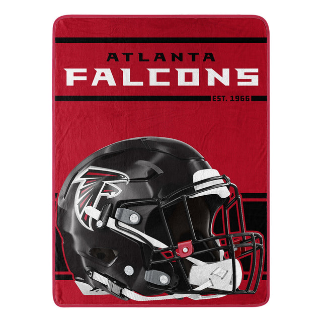 Manta de los Atlanta Falcons de 46 x 60 pulgadas con diseño Micro Raschel Run enrollada