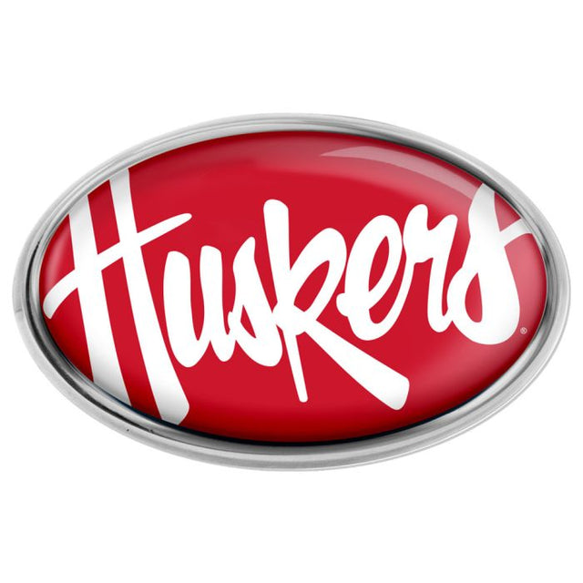 Emblema de metal cromado abovedado de los Nebraska Cornhuskers