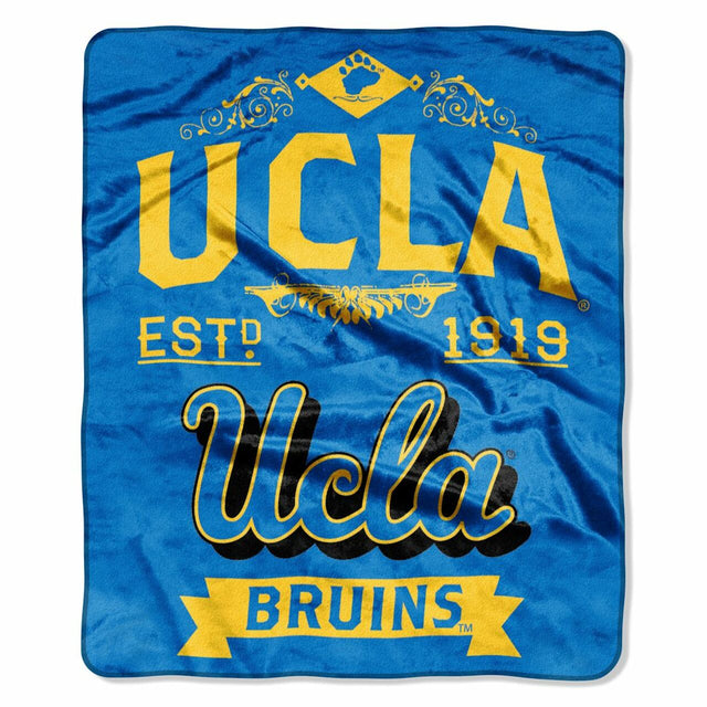 Manta de los Bruins de UCLA de 50 x 60 con diseño de etiqueta Raschel