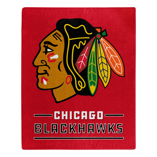 Manta de los Chicago Blackhawks de 50 x 60 con diseño de interferencia de Raschel